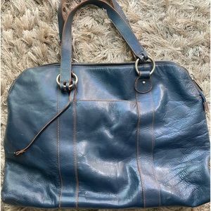 Hobo brand tote/laptop bag in blue leather. Outside and inside pocket for phone.